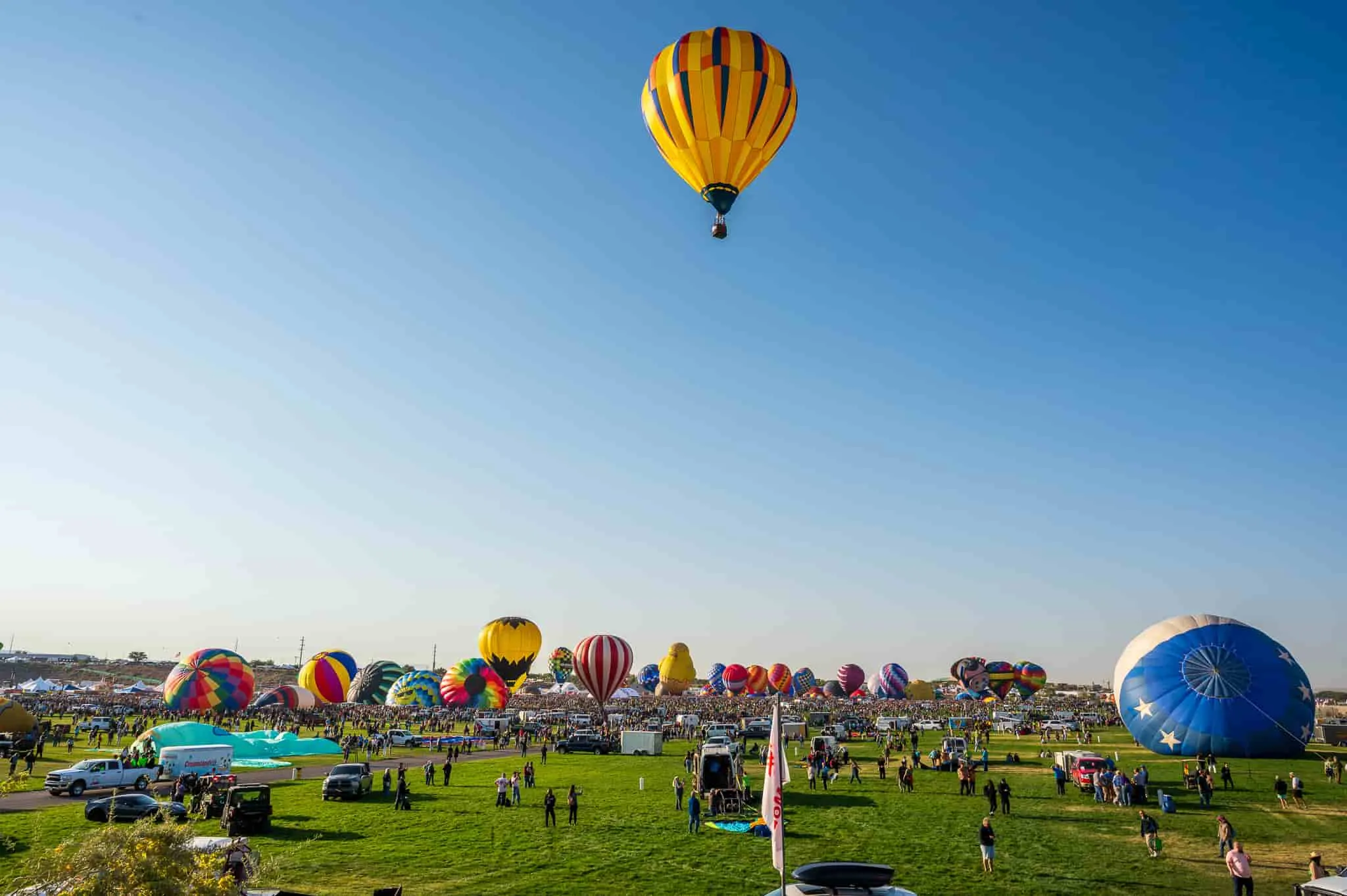 Hot air balloons representing a Santa Fe business rising above its local competition